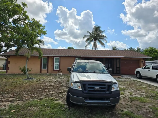 Single story home with a garage