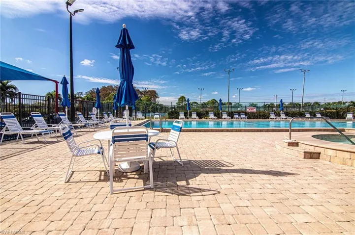 View of swimming pool featuring a jacuzzi and a patio area