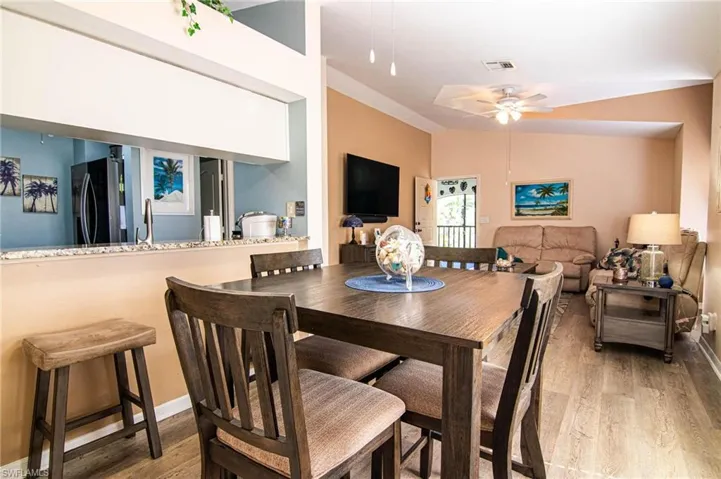 Dining room featuring light hardwood / wood-style floors, ceiling fan, and sink
