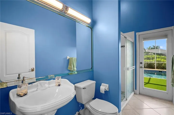 Full bathroom featuring tile patterned floors and a stall shower