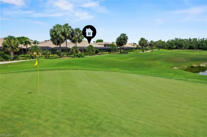 Surrounding community with golf course view, a water view, a putting green, a yard, and a residential view
