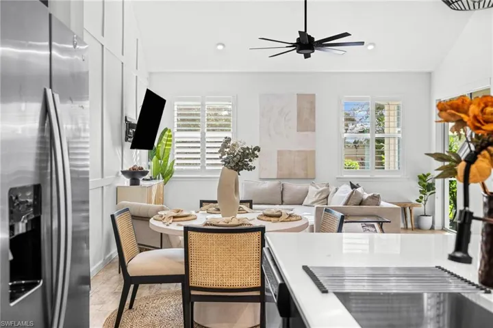 Open-concept living space with vaulted ceilings and wood-finish flooring