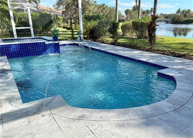 View of swimming pool with a water view