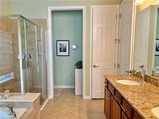 Primary Bathroom with dual sinks vanity, and independent shower and bath