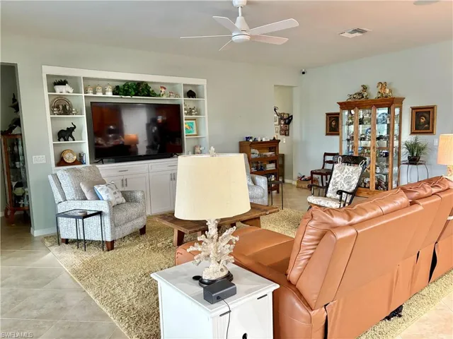 Tiled living room with ceiling fan