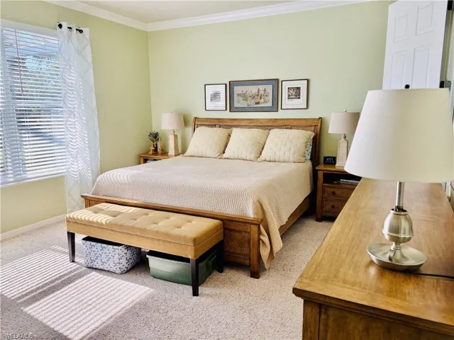 1st Main bedroom suite featuring crown molding