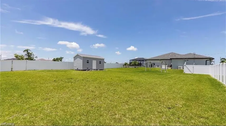 View of yard with a storage shed