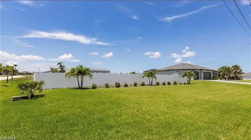 View of yard with a garage