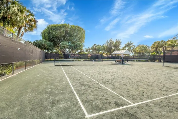 View of tennis court featuring a gazebo