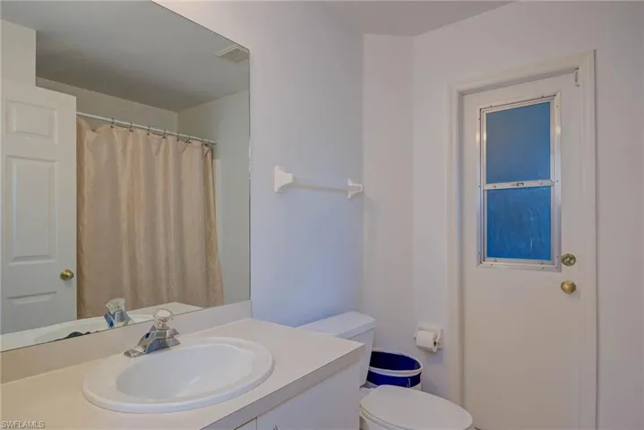 Full bathroom featuring vanity and a shower with shower curtain