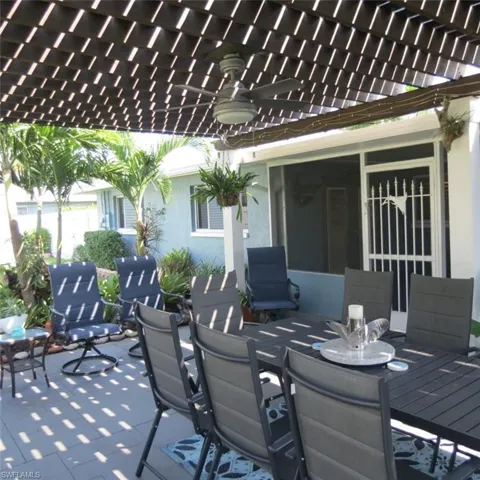 View of patio with a pergola and ceiling fan