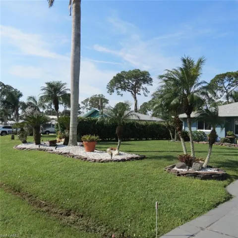 View of community featuring a lawn