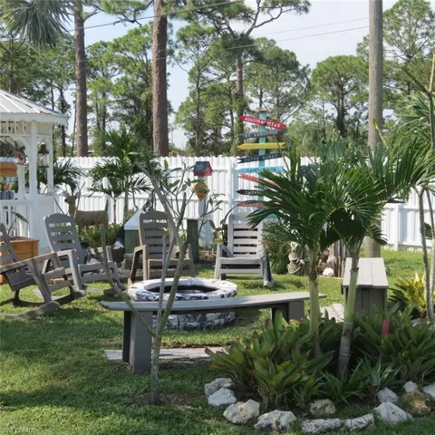 View of property's community with a yard