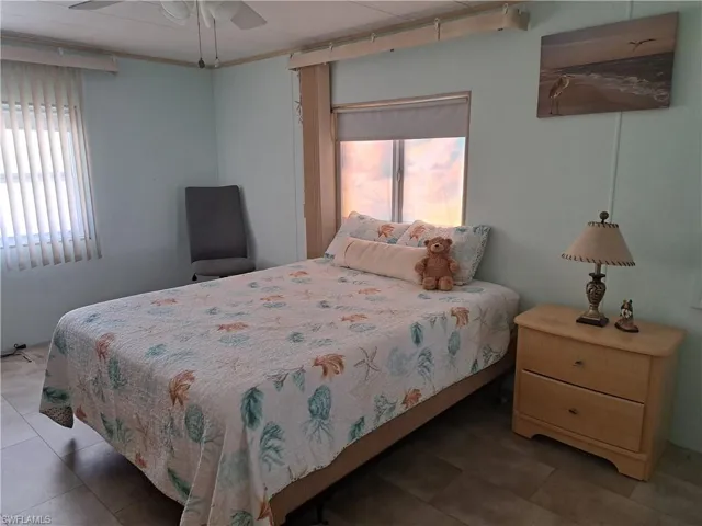 Tiled bedroom with ceiling fan