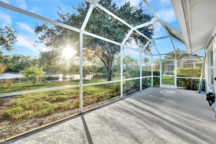 Unfurnished sunroom with a water view and plenty of natural light