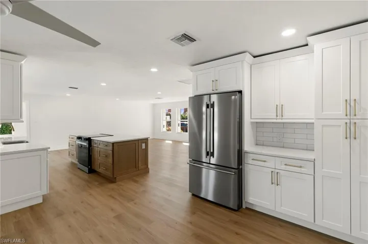 Modern kitchen with stainless steel appliances and ample cabinetry.