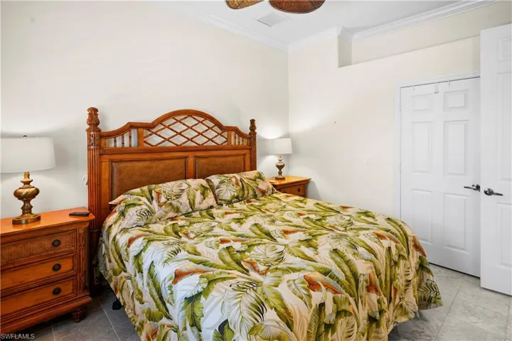 Bedroom featuring crown molding and ceiling fan