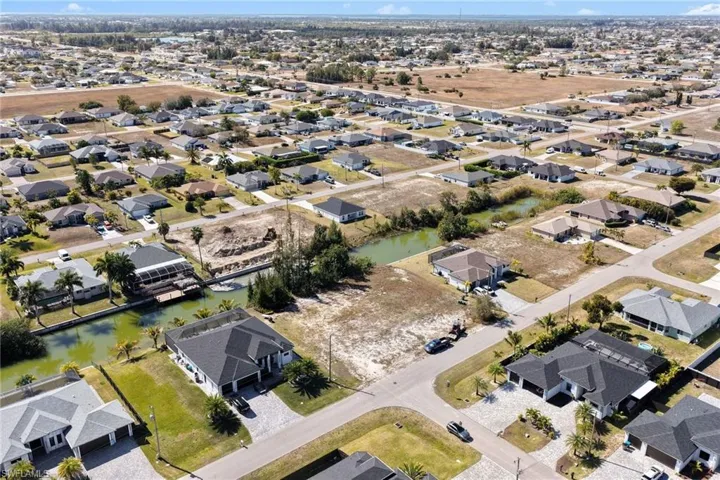 Aerial view of residential area with a large body of water