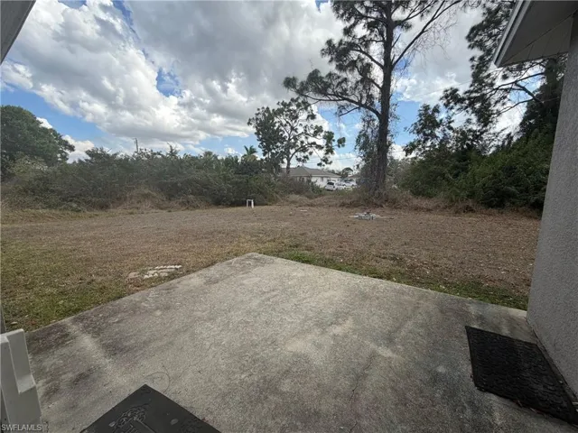 View of yard with a patio