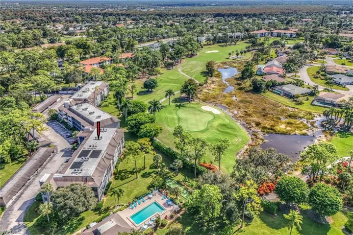 View of property location with a large body of water and a golf club
