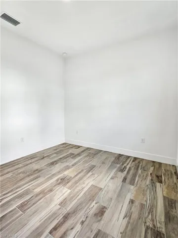 Unfurnished room featuring light wood-style floors
