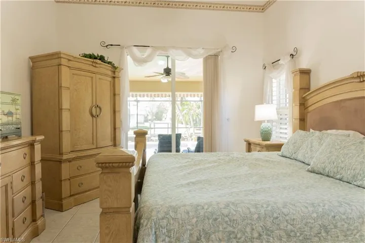 Tiled bedroom with access to outside