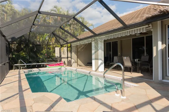 View of pool featuring a lanai and a patio area