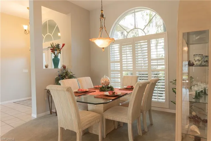 Dining space featuring light carpet