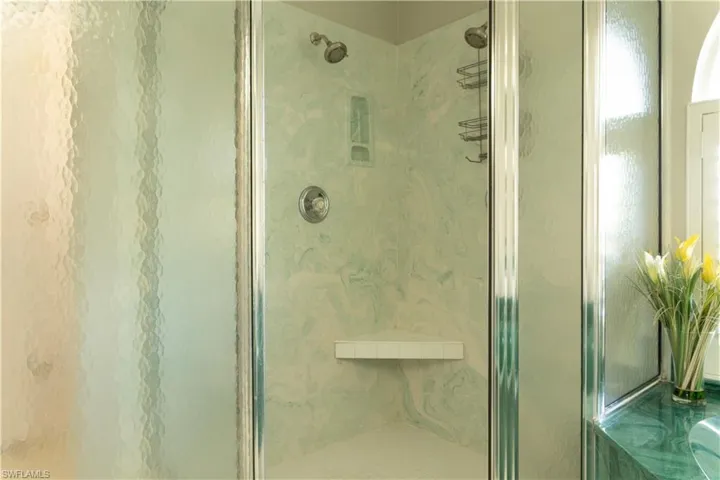 Bathroom featuring a shower with shower door
