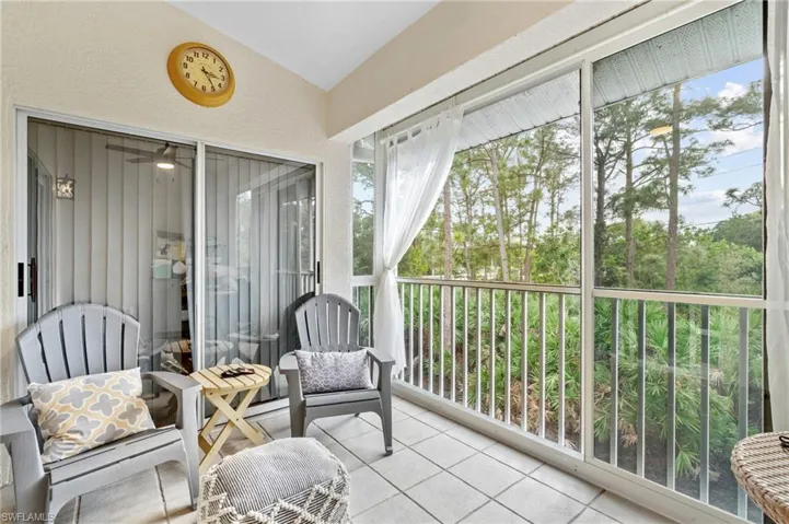Sunroom featuring vaulted ceiling