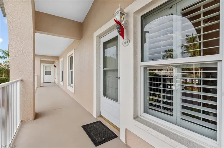 Entrance to property with a balcony