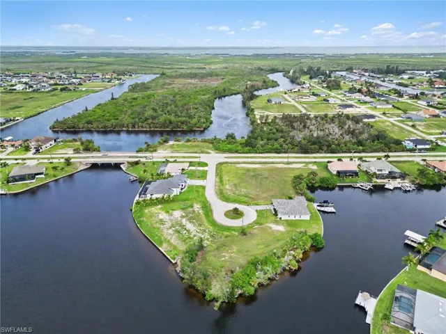 Aerial overview featuring expansive waterfront property with canal access