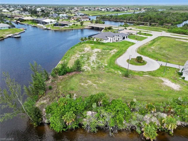 Expansive waterfront lot featuring mature vegetation along the water's edge