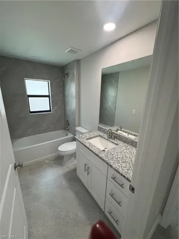 Full bathroom featuring vanity and tub / shower combination