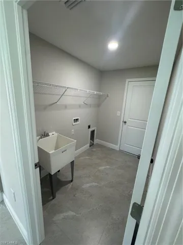 Laundry area with washer hookup and electric dryer hookup