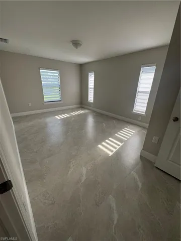 Empty room with baseboards