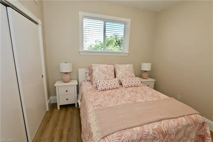 Bedroom with a closet and wood finished floors