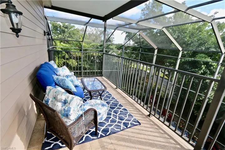 Balcony featuring a sunroom