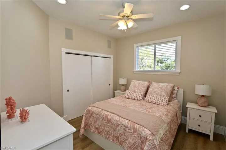 Bedroom featuring recessed lighting, wood finished floors, a closet, and a ceiling fan