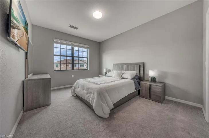 Bedroom with light carpet