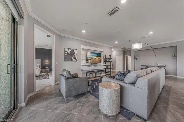 Tiled living room with crown molding