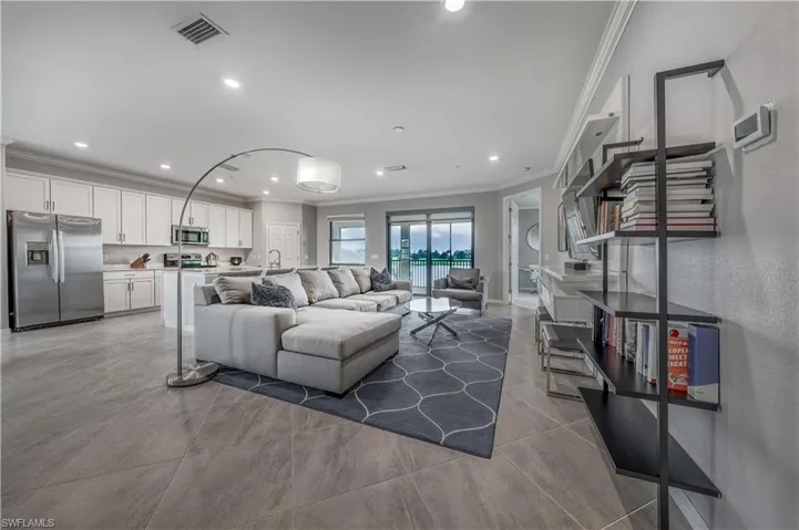 Living room featuring ornamental molding