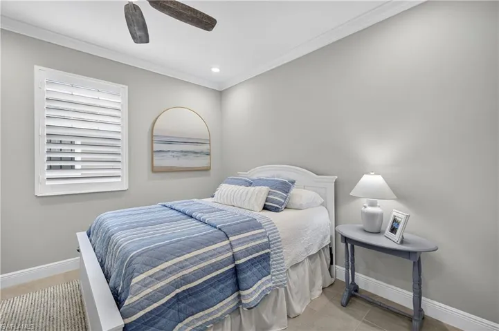 Bedroom featuring crown molding, a ceiling fan, recessed lighting, and light tile patterned floors