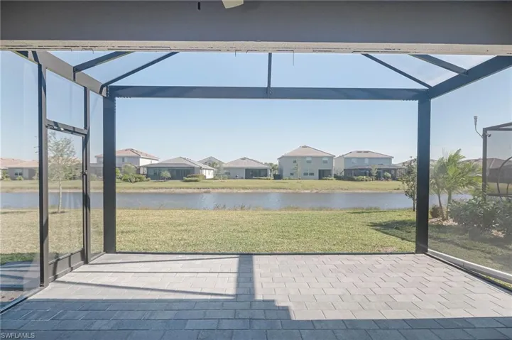 Unfurnished sunroom with a water view
