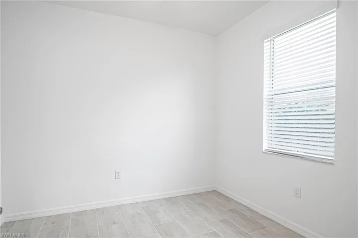 Empty room featuring light hardwood / wood-style flooring