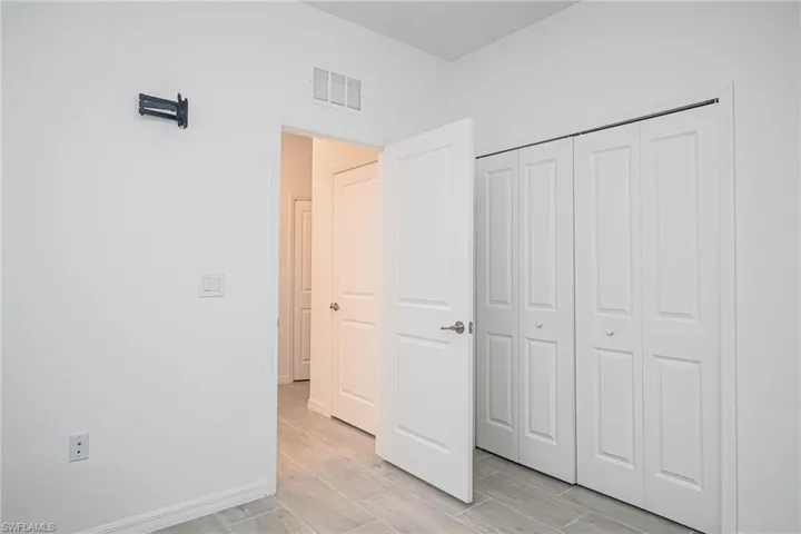 Unfurnished bedroom with a closet