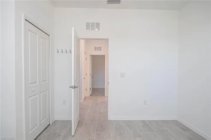 Unfurnished room with light wood-type flooring