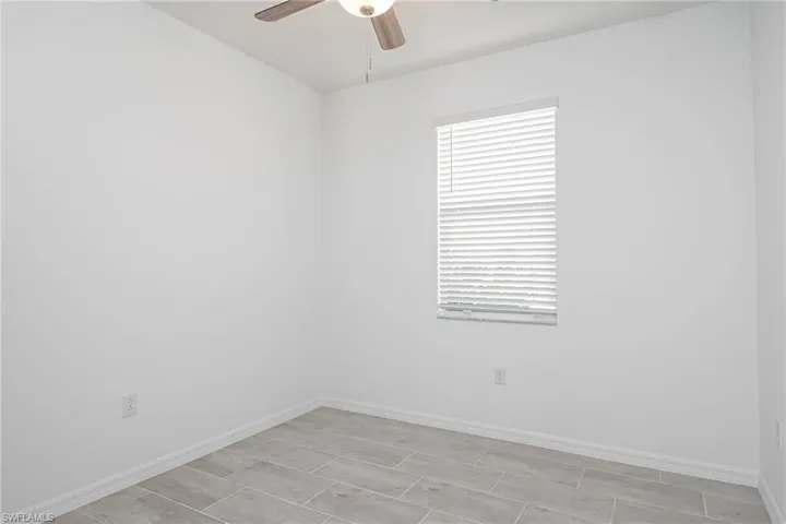 Unfurnished room with ceiling fan