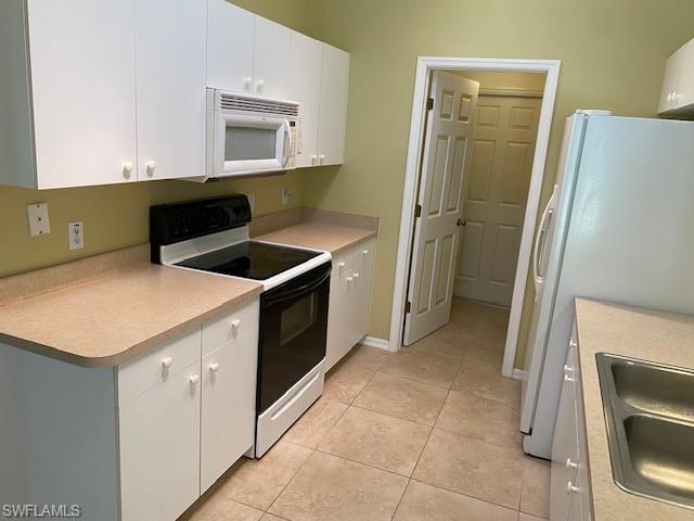 view of kitchen towards laundry room and access to garage