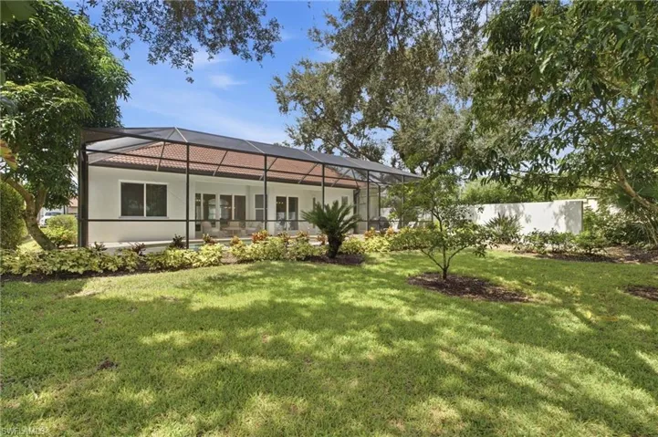 Screened-in patio with tile roof
